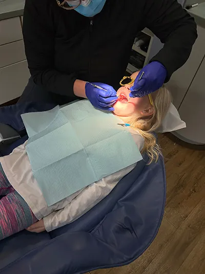 Doctor with child patient at Lisa Siddall, DDS